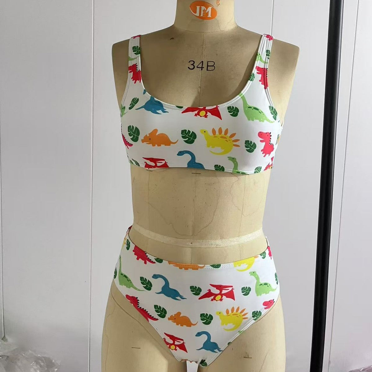 Damen Sport-Bikini mit verspieltem Dinosaurier-Muster