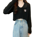 Damen Cropped Pullover mit einem Knopfverschluss und Einhorn-Emblem