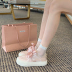 Damen Sneaker mit dekorativen Schleifen und hochwertiger Oberflächenstruktur