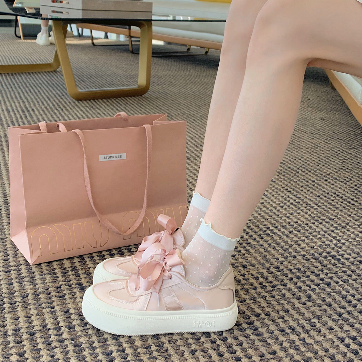Damen Sneaker mit dekorativen Schleifen und hochwertiger Oberflächenstruktur
