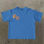 Damen T-Shirt mit künstlerischem floralem Druck und verspieltem Schriftzug R&B
