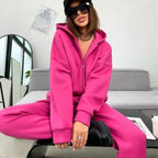 Damen Sportlicher Jumpsuit mit durchgehendem Reißverschluss und Kapuze