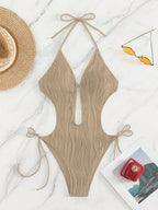 Damen Einteiliger Badeanzug mit raffiniertem Cut-Out und stylischem Wellenmuster