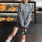 Damen Strickjacke im skandinavischen Stil mit dekorativem Muster und praktischen Taschen