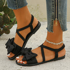 Damen modische Riemchen-Sandalen mit dekorativem Schleifen-Detail und ergonomischer Sohle R&B