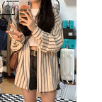 Damen gestreifte Overshirt-Bluse im lässigen Schnitt mit übergroßen Ärmeln