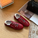 Damen Sportliche Sneakers aus glänzendem Metallic-Leder mit flexiblem Schnürsystem