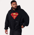 Herren nan weit geschnittener Kapuzenpullover mit markantem Comic‑S‑Logo Kängurutasche und gewaschener Look R&B
