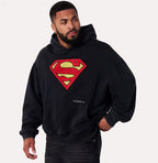 Herren nan weit geschnittener Kapuzenpullover mit markantem Comic‑S‑Logo Kängurutasche und gewaschener Look R&B