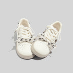 Damen Sneakers mit floralem Druck und innovativem Schnürsystem
