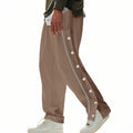 Herren nan weite Trackpants mit seitlicher Druckknopfleiste, elastischem Bund und reflektierendem Streamline-Streifen R&B