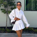 Damen modisches kurzämliges Set aus fließendem Material mit cropped Bluse und weit schwingendem Rock R&B