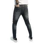 Herren Skinny Fit Jeans im kreativen Rissdesign und bunten Farbsklecks R&B