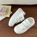 Damen Sneakers mit farbigen Knopf-Details und flexiblem Design