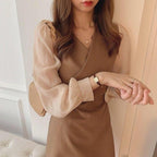 Damen Kleid mit stylischen Puffärmeln und eleganter Taillierung
