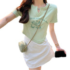 Damen Kurzarmshirt mit elegantem Knopfdesign und kreativem Grafikdruck