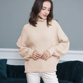 Damen Grobstrickpullover mit Rollkragen und luftiger Schnittgestaltung