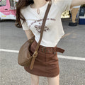 Damen Kurzarmshirt mit elegantem Knopfdesign und kreativem Grafikdruck