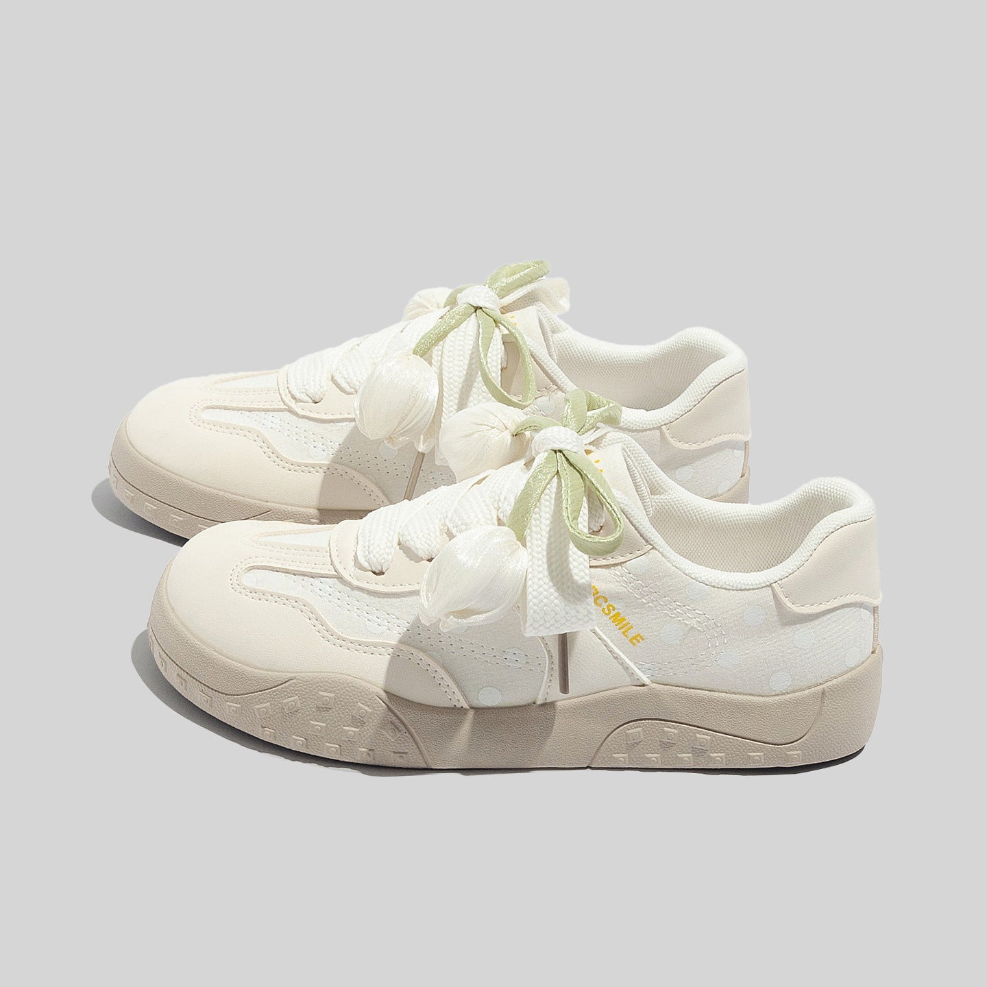 Damen Freizeit Sneakers mit leichtem Punktemuster und verspielten Schleifen