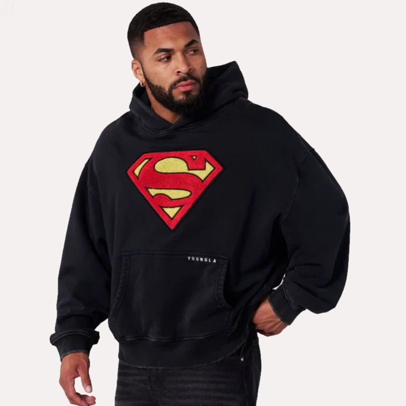Herren nan weit geschnittener Kapuzenpullover mit markantem Comic‑S‑Logo Kängurutasche und gewaschener Look R&B