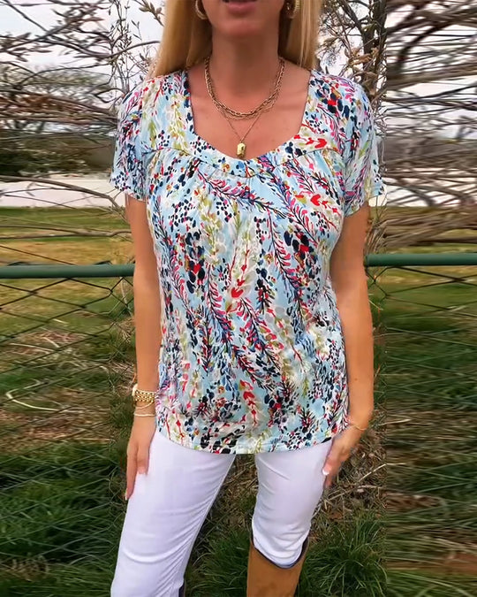Damen Kurzarmbluse mit floralem Muster und raffiniertem Schnitt Heidi-Mode