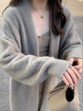 Damen Gemütliche Strickjacke mit oversized Schnitt und sanften Puffärmeln