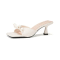 Damen elegante Mules mit dekorativem Schleifenakzent und modernem Absatz