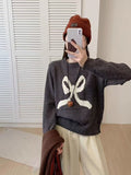 Damen Kuscheliger Pullover mit verspieltem Schleifenmotiv und weitem Schnitt