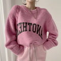Damen Oversized Pullover mit auffälligem Schriftzug und gestricktem Muster