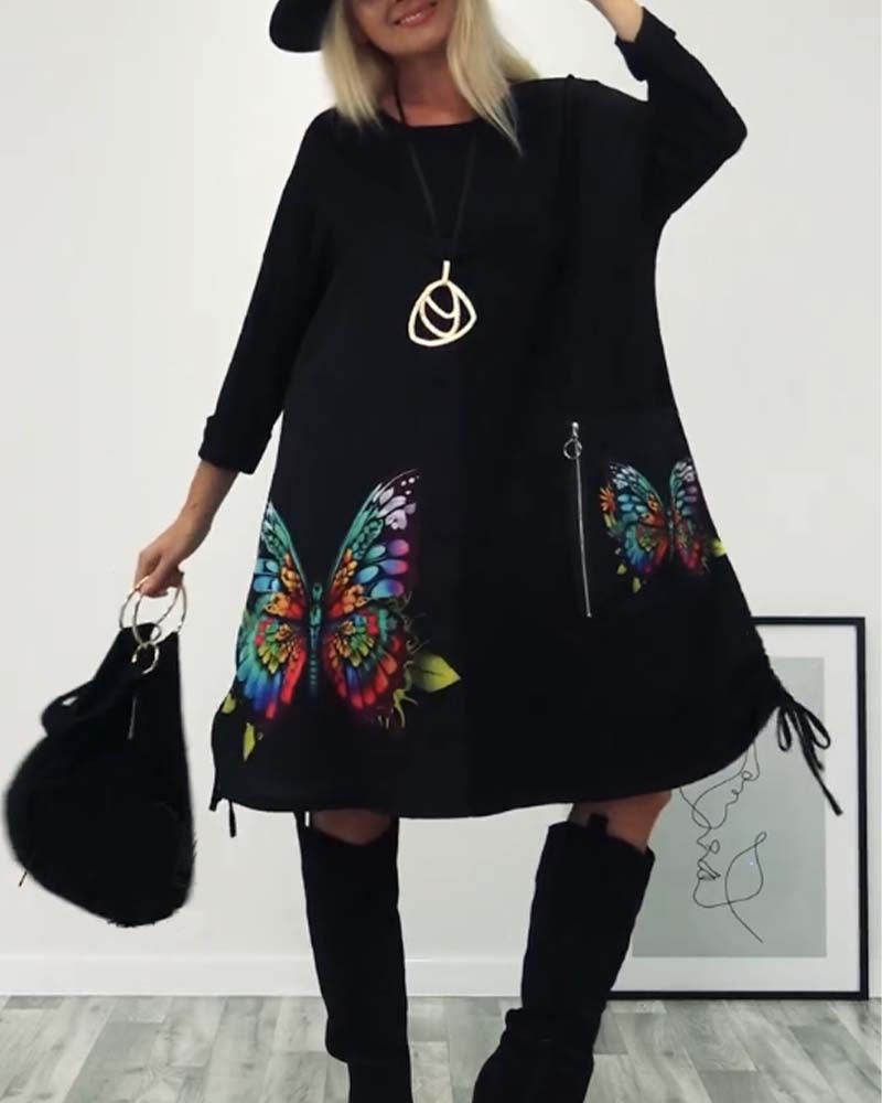 Damen Kleid mit buntem Schmetterlingsdruck und seitlichen Taschen Heidi-Mode
