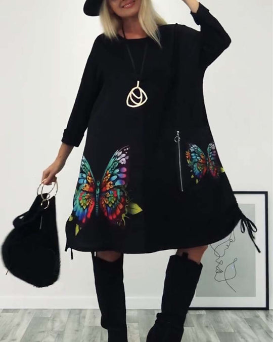 Damen Kleid mit buntem Schmetterlingsdruck und seitlichen Taschen Heidi-Mode