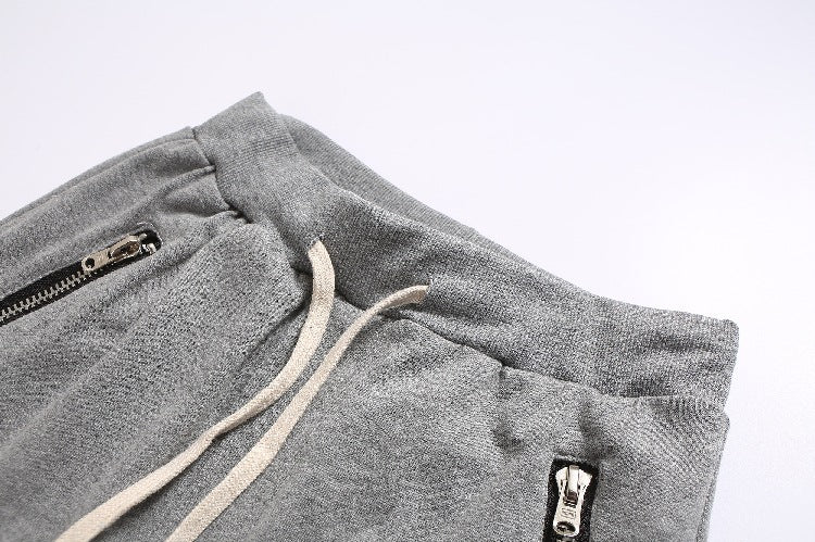 Herren Sportliche Jogginghose im modernen Design mit seitlichen Reißverschlüssen