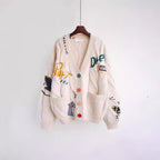 Damen Strickjacke mit buntem Motiv und praktischen Taschen R&B
