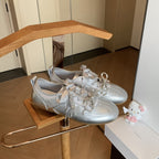 Damen Modische Sneakers aus metallischem Leder mit angesagtem Schleifenakzent