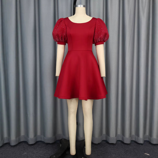 Damen Cocktailkleid mit voluminösen Puffärmeln und schimmernden Akzenten R&B