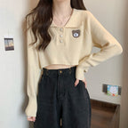 Damen Cropped Pullover mit einem Knopfverschluss und Einhorn-Emblem