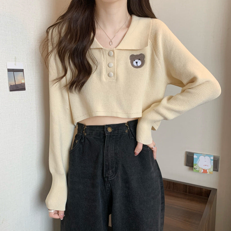 Damen Cropped Pullover mit einem Knopfverschluss und Einhorn-Emblem