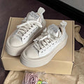 Damen Sneakers mit glitzernden Applikationen und hochgezogenem Plateau