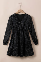 Elegante schwarze Glitzerkleid mit Netzbespannung