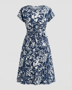 Damen Kleid mit floralem Muster und Bindegürtel